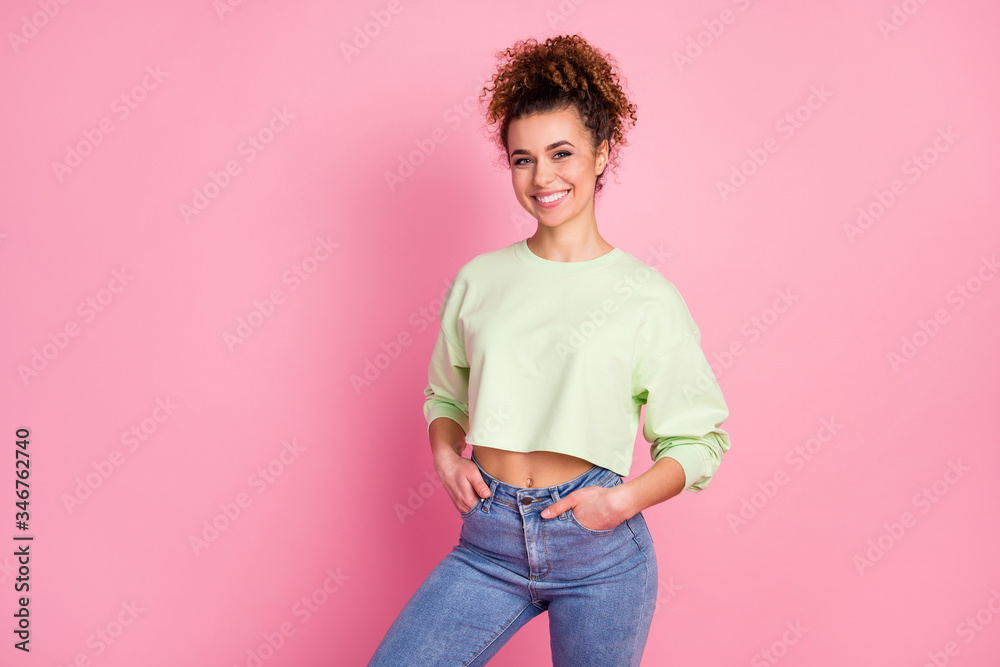 Portrait of her she nice-looking attractive lovely pretty content cheerful cheery girl wearing green crop top posing isolated over pink pastel color background - obrazy, fototapety, plakaty 