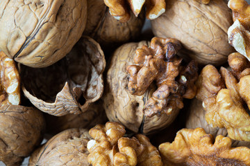 whole and cracked walnuts close up top view horizontal