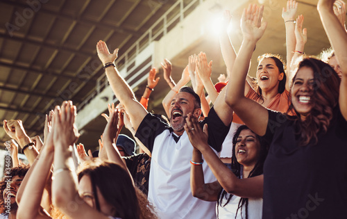 Cuadros en Lienzo Crowd of sports fans cheering during a match in stadium