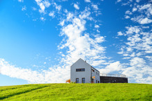Modern House On Green Meadow. Blue Sky, Edit Space. Architecture Photo.