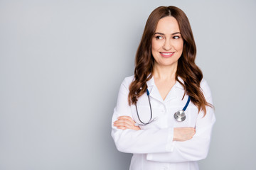 Close-up portrait of her she nice attractive pretty cheerful cheery skilled experienced medic red foxy ginger wavy-haired therapist folded arms copy space isolated over grey pastel color background