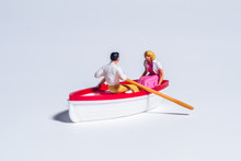 Miniature Figure Concept Of Paddling The Boat