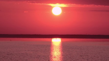 Wall Mural - view on the river with calm water sky rising sun warm sunrise