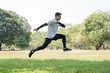 © Chanakon - Young handsome sport man jumping training outdoors healthy lifestyle and sport concept.