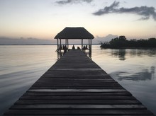 Beautiful Ocean View With Clean Water, Evening Or Night Amazing Background Of Island, Caribbean, Lagoon Bacalar. Calm Secluded Place. People Meet The Damn Or Sunset, Paradise