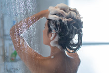 Asian Woman Washing Hair And Showering