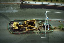 High Angle View Of Earth Mover At Road Construction Site