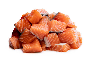 Fresh salmon fillet cubes isolated on white