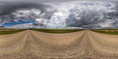 Wall Mural - full seamless spherical hdri panorama 360 degrees angle view on gravel road among fields in spring d