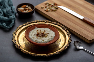 Wall Mural - Phirni, a traditional and delicious indian style milk and rice based creamy dessert, served in clay pot