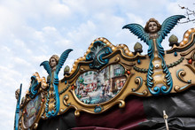 Details With Angels On Top Of An Old Vintage Carousel Ride In The City Center Of Eindhoven, The Netherlands On The Markt. An Authentic Retro Merry Go Round