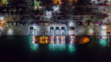 Time Lapse Container , Container Ship In Export And Import Business And Logistics. Shipping Cargo To Harbor By Crane. Water Transport International. Aerial View And Top View.