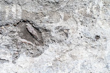 Background, texture, rough concrete wall, with cracks and holes.