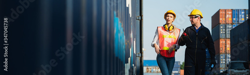 Fotomural Two foreman man & woman worker working checking at Container cargo harbor to loading containers