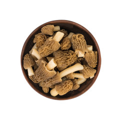 Wall Mural - Clay bowl with fresh morels isolated on a white background.