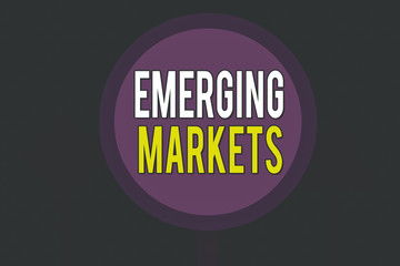 Poster - Conceptual hand writing showing Emerging Markets. Concept meaning country that has some characteristics of developed stores Three Blank Safety Road signs lighted and dark Street Sign