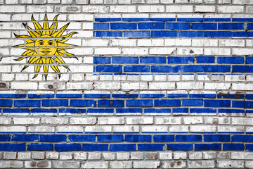 Wall Mural - Flag  banner on brick wall background.