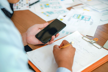 creative web designers and applications work together in the office.