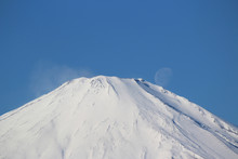 Low Angle View Of Snow Covered Mt Fuji Against Sky