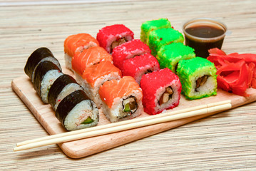 sushi rolls set served on wooden tray