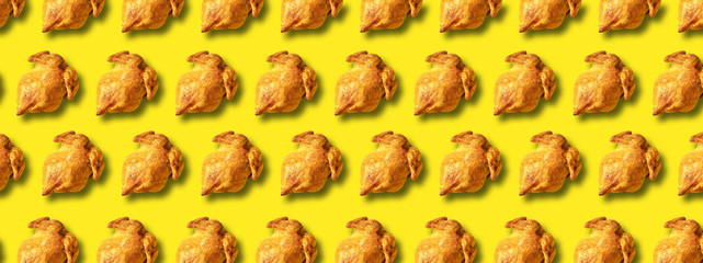 Wall Mural - colorful pattern of roasted chicken or turkey on yellow background. top view. creative design for pa