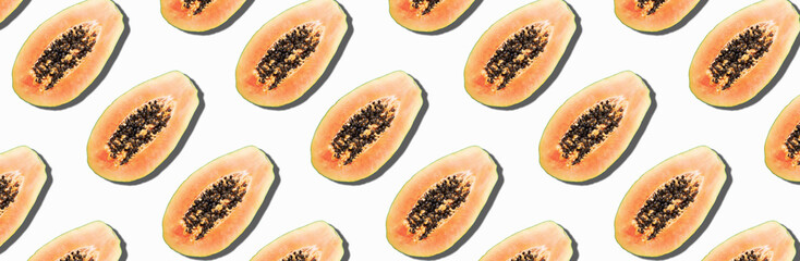 Wall Mural - Seamless pattern with papaya. Tropical abstract background. Top view. Creative design, minimal flat lay concept. Summer time. Tropical travel, exotic papaya fruit. Vegan and vegetarian food