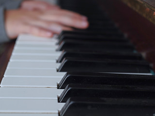 Practicing on piano, Teenager's hand, black and white keys, Concept developing finger's motion skill,