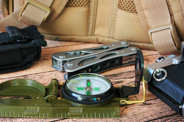 a compass and a backpack for a hike