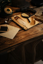Composition With Vintage Detective Items On Wooden Table