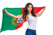 © Andrey_Arkusha - Young woman holding a large flag of Portugal