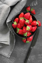 Fresh Strawberries In Bowl On Grey
