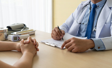 Asian woman patient visits the doctor at the clinic in hospital because she gets sick. healthcare and medical concept