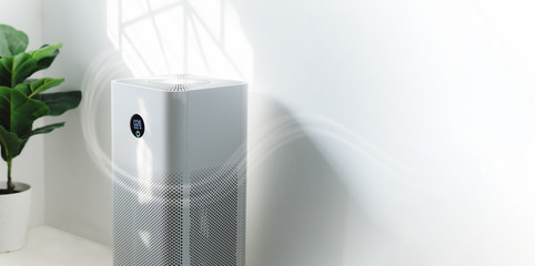 air purifier a living room, air cleaner removing fine dust in house. protect pm 2.5 dust and air pol