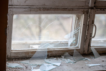 Poster -  broken window in a residential building
