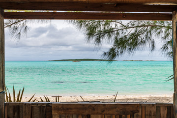 Wall Mural - View of Coco Plum beach through the window of a small wooden house (Great Exuma,  Bahamas).