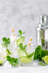 Wall Mural - Refreshing summer alcoholic cocktail mojito with ice, fresh mint and lime