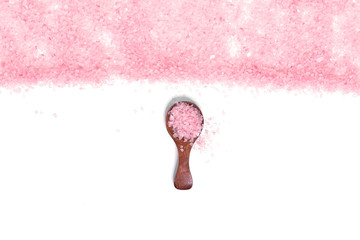 Pink salt isolated in scoop on white background. selective focus or blurry.