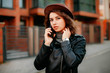 © Катя Іваськевич - young woman with mobile phone in the city. coronavirus. covid-19.