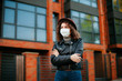 © Катя Іваськевич - young woman  in the city in mask. coronavirus. covid-19.