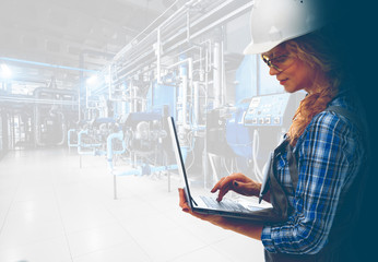Wall Mural -  Attractive female industrial engineer with laptop inspect modern industrial gas boiler room. Heating gas boilers, pipelines, valves. Mixed media with copy space