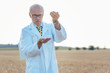 © Kzenon - Agricultural scientist looking for quality of new seeds