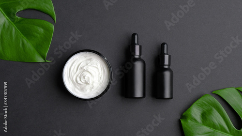 Cuadros en Lienzo Set of luxury cosmetic products on black background top view