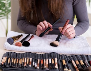 Wall Mural - Make-up artist preparing brushes for work