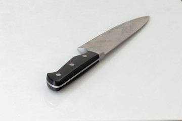 stainless steal kitchen knife on white table 