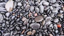 Wet Pebbles Of Vik Beach In South Iceland