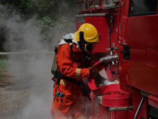 Sticker - firefighter spray water to fire burning car workshop fire training