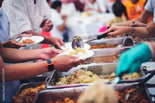 Fotomural Concept of free food serving : Starvation issues help with food donations