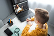© Aliaksandr Marko - Distance learning, a boy learns math while looking at a laptop beech during an online lesson. The concept of online education, home education, technology, quarantine, self-isolation.