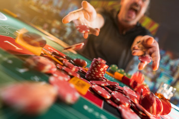 Wall Mural - Man playing roulette at the casino