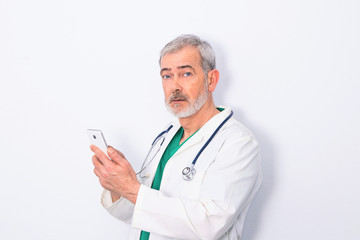 portrait of doctor with mobile phone isolated on white